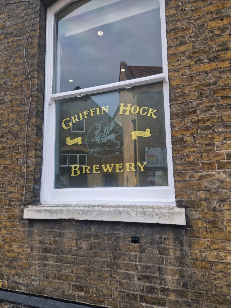 Griffin Hock Brewery window sign at Fuller's Griffin Brewery in Chiswick, West London.