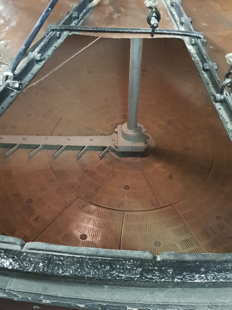 Fuller's original mash tun - viewed from the top to the slotted false bottom and rakes