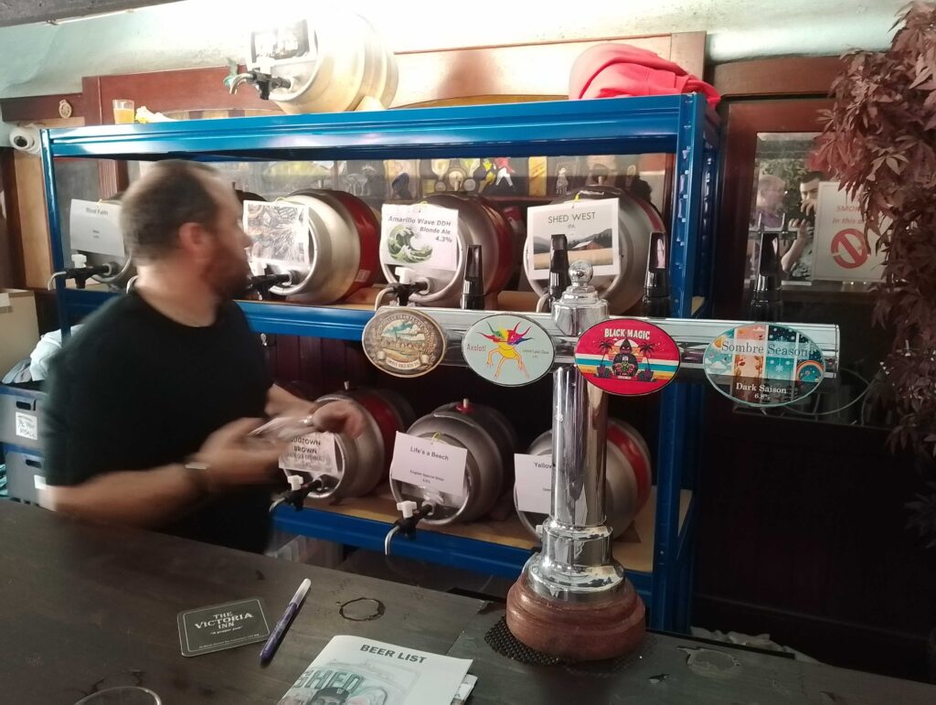 Tony Tilbury working the bar at the 2024 ACB Shed Festival